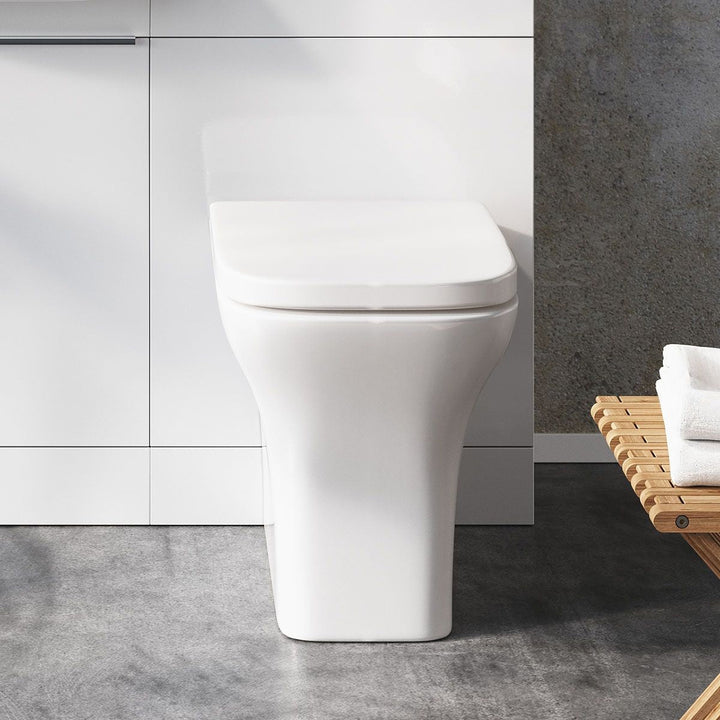 '- Amara Skipton Back to Wall Toilet With Wrap Over Seat in White - Coa Living